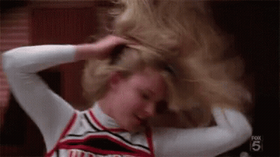 Cheerleader Holding Ponytail GIF