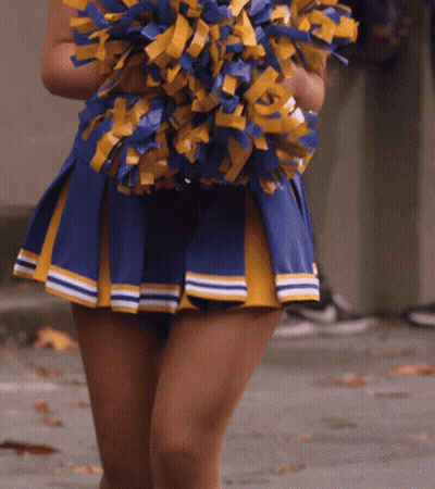 Cheerleader In Blue And Yellow Skirt Holding Pom Poms GIF