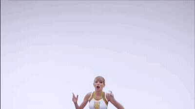 Cheerleader In Crop Top And Blue Skirt Jumping GIF