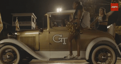 Cheerleader In Front Of Car Saying GT GIF