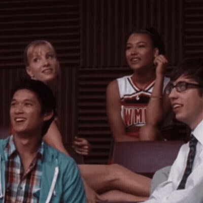 Cheerleader In UCSD Jersey Beside Man GIF