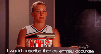 Cheerleader In WMHS Uniform At Podium GIF