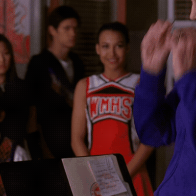 Cheerleader In WMHS Uniform Next To Woman GIF