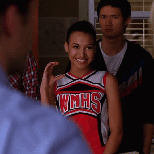 Cheerleader In WMHS Uniform Smiling Man Watching GIF