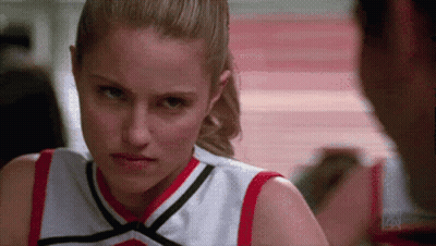 Cheerleader Looking At Man In Gym GIF
