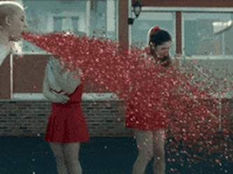 Cheerleader Puking Red Glitter Bomb GIF