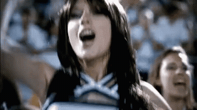 Cheerleader Singing In Front Of Crowd GIF