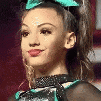 Cheerleader Smiling With Bow GIF