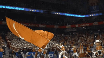 Cheerleader Waving Orange Flag At Valero Alamo Bowl GIF
