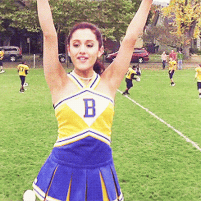 Cheerleader With Letter B Raising Arms GIF