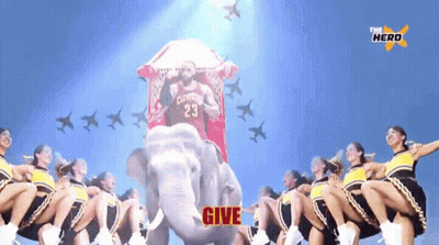 Cheerleaders Are Riding An Elephant With A Man In A Cleveland Jersey GIF