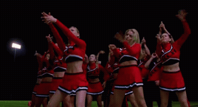 Cheerleaders Dancing In A Field At Night GIF