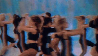 Cheerleaders Dancing In A Row On Stage GIF
