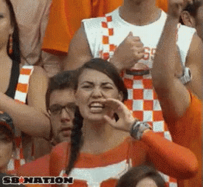 Cheerleaders Dancing In Front Of Mascot In T-Shirt GIF