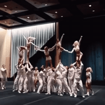 Cheerleaders Doing Pyramid On Stage GIF