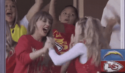 Cheerleaders High-Fiving In Front Of KC Sign GIF