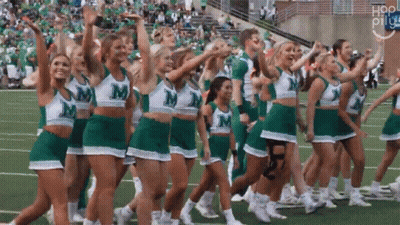 Cheerleaders In Green And White Uniforms With Letter M GIF