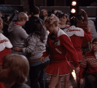 Cheerleaders In Red Uniforms With Cheerios GIF