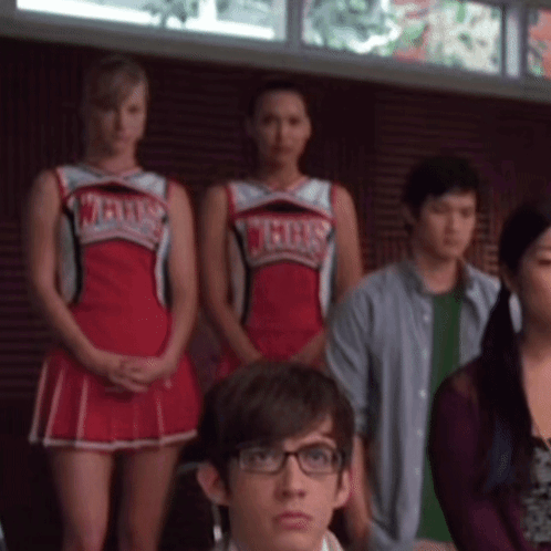 Cheerleaders In Vegas Uniforms Standing In Room GIF