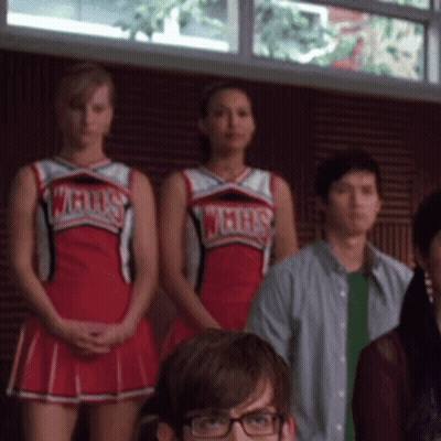 Cheerleaders In WMHS Uniforms Standing In Room GIF