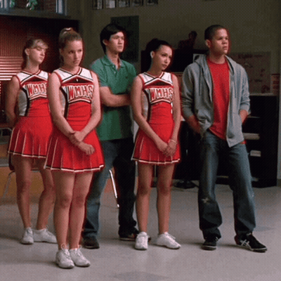Cheerleaders in WMHS Uniforms Standing in Row