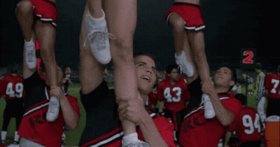 Cheerleaders Lifted By Man In Number 2 Jersey GIF