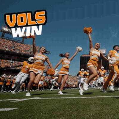 Cheerleaders On A Football Field With The Words Vols Win Behind Them GIF