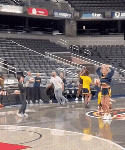 Cheerleaders Performing On Basketball Court GIF