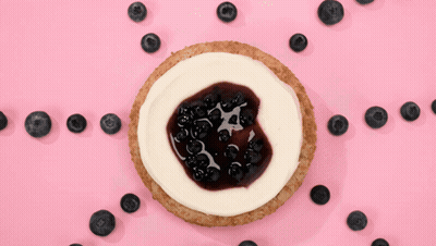 Cheesecake With Blueberries On Pink Surface GIF