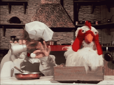 Chef Cooking While Stuffed Chicken Looks On GIF