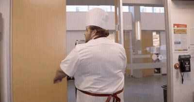 Chef In Hat Standing In Front Of Emergency Procedures Sign GIF
