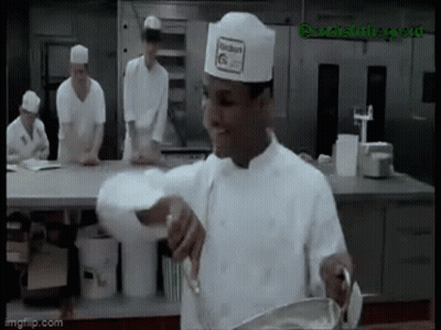Chef In Hat Stirring In Kitchen GIF