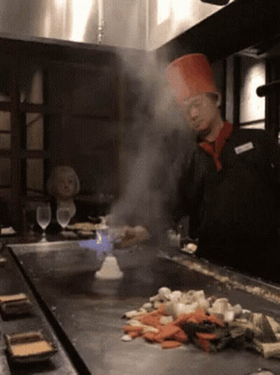 Chef In Red Hat Cooking Vegetables GIF