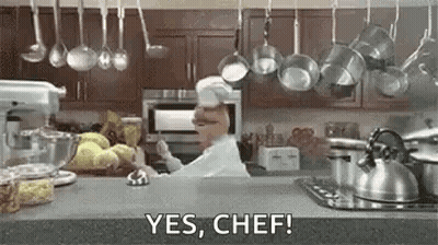 Chef Saying Yes Chef With Hanging Pots Pans GIF