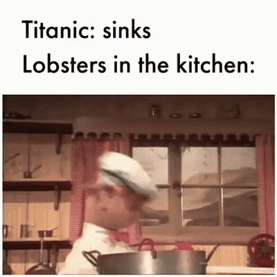Chef Standing In Kitchen With Pot Of Lobsters GIF