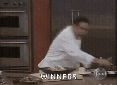 Chef Standing In Kitchen With Winners GIF