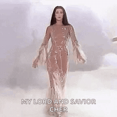 Cher In Long Dress With Arms Outstretched In Clouds GIF