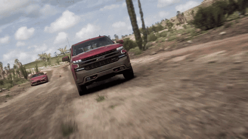 Chevrolet Truck Driving Down Dirt Road GIF