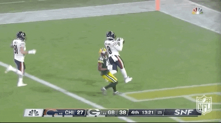 Chicago Bear Players Chasing Down Football GIF