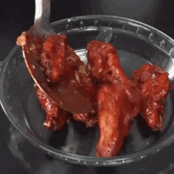 Chicken Wing Drizzled With Sesame Seeds GIF