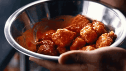 Chicken Wing In A Bowl Smothered With Sauce GIF