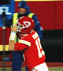 Chiefs Member Running Removing Helmet GIF