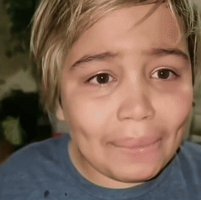 Child Close Up With Blue Shirt GIF