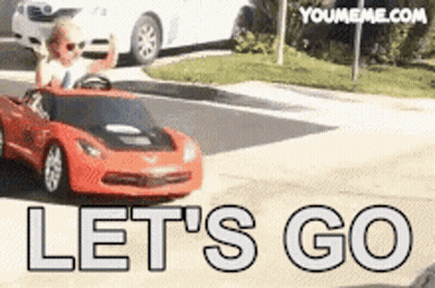 Child Driving Red Toy Car Saying Let's Go GIF