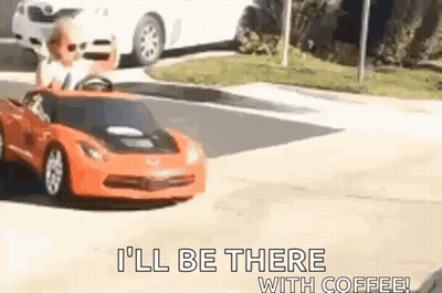 Child Driving Toy Car Down Street GIF