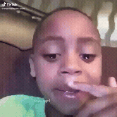 Child Face Close Up With TikTok Logo GIF