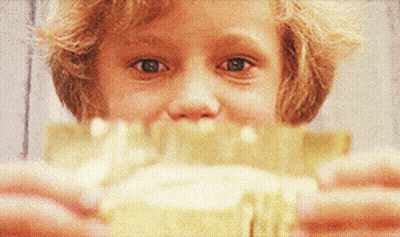 Child Holding Food GIF