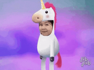 Child In Unicorn Costume With Rainbow Tail GIF