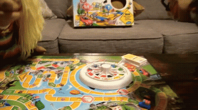Child Playing Board Game With Box GIF