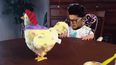 Child Playing With Stuffed Chicken Tag Saying Chicken GIF
